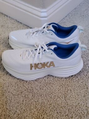 Hoka Bondi 8 White Sneakers with Blue Lining and Gold Logo